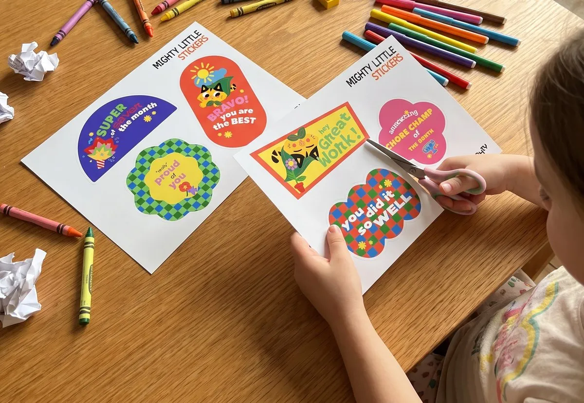 A child cutting out Mighty sticker sheets at a table